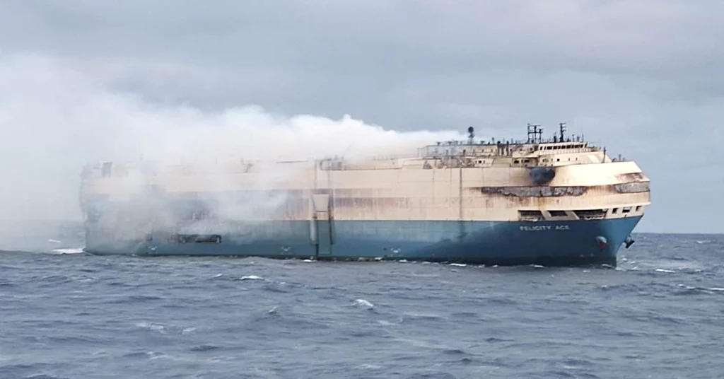 Firefighters struggle to put out the flames on a luxury motor ship off the Azores