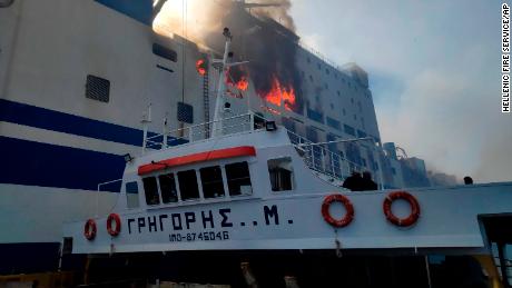 A ship approaches the burning ferry on February 18.
