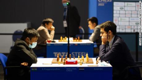 Anish Giri (right) competes against Praggnanandhaa (left) during the 2022 Tata Steel Chess Championship.