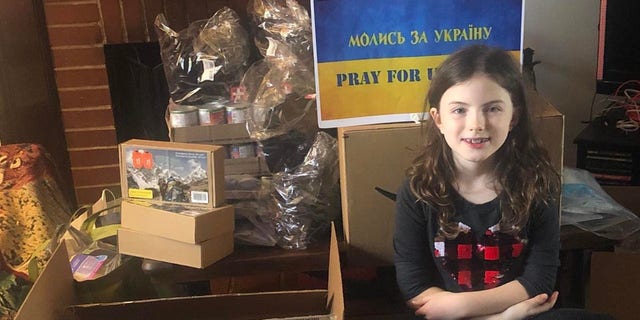Lesia Gorgosky's daughter, Anna, helps with fundraising efforts.