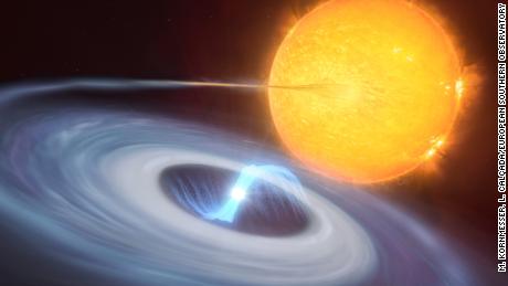 This illustration shows a two star system.  A blue disk of material can be seen orbiting a white dwarf as it pulls material away from the companion star.