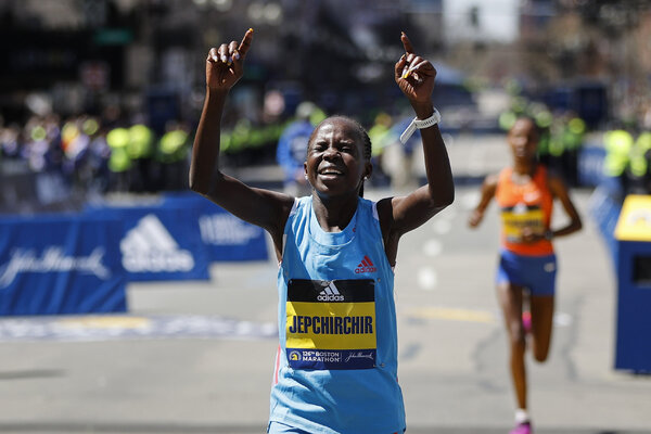 Peres Jepchirchir of Kenya crossed the finish line four seconds ahead of Ababel Yeshaneh of Ethiopia, in the background.