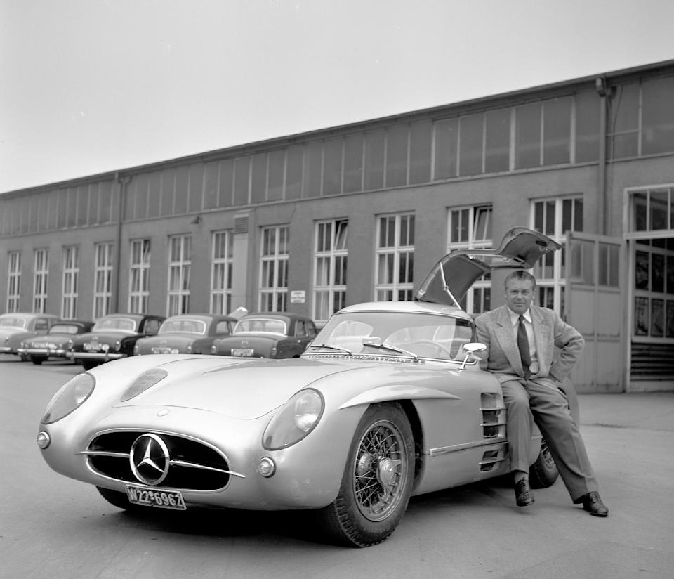 The photo shows one of two Uhlenhaut Coupe 300 SLRs along with inventor Rudolph Uhlenhaut.  This car is on display in the Mercedes-Benz Museum. 