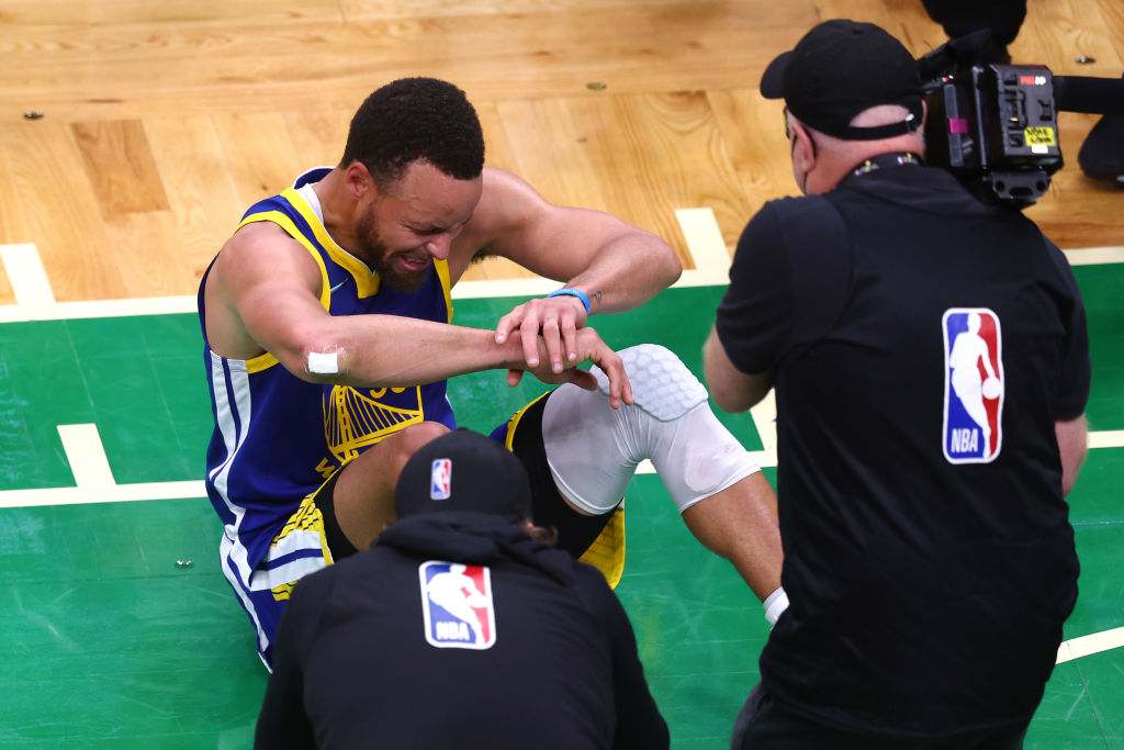 Curry cries on the court after Golden State win the NBA Finals