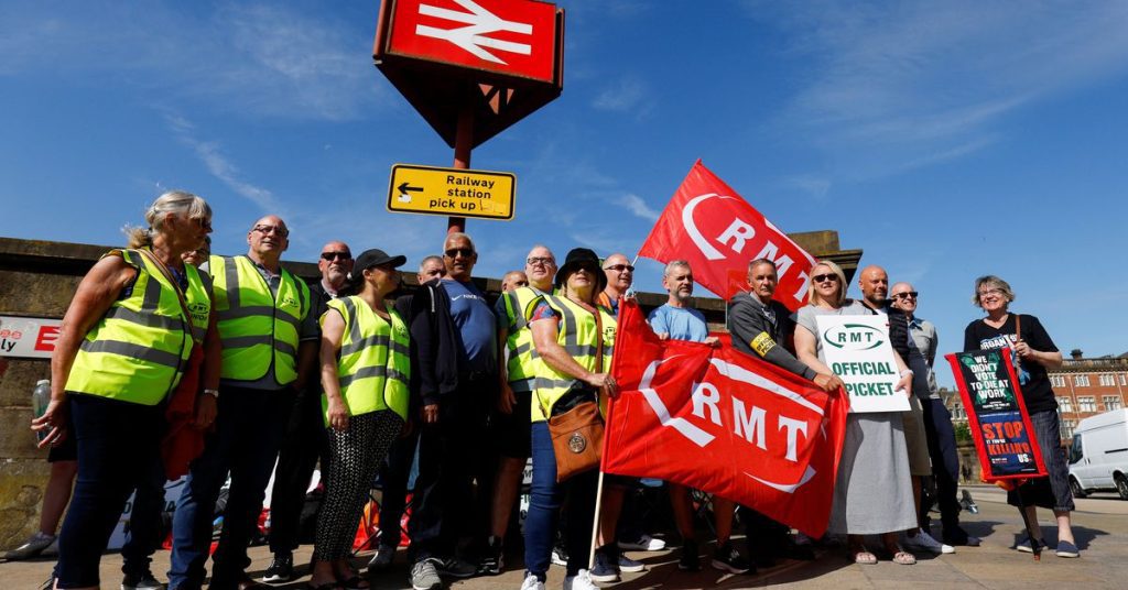 Thousands walk out in Britain's biggest rail strike in 30 years as Johnson vows to stay firm