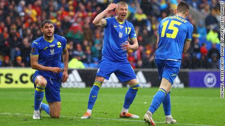 Ukraine players look at Wales. 