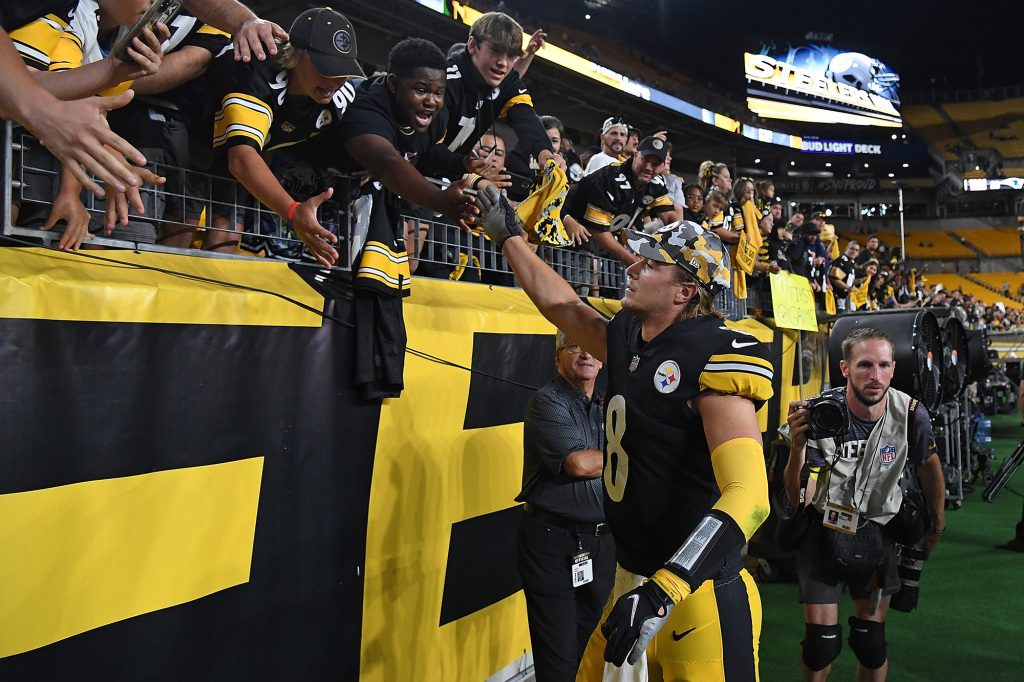 Kenny Beckett slaps the crowd after the Steelers' victory over the Seahawks on Saturday.