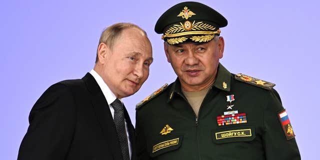 Russian President Vladimir Putin, left, pledges to enhance Russia's military cooperation with its allies during the Army 2022 International Military and Technical Forum at Patriot Park, outside Moscow, Russia, on August 15, 2022.