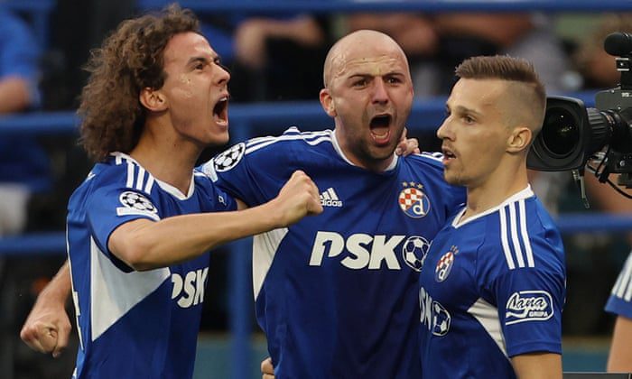 Mislav Orcic of Dinamo Zagreb (right) celebrates scoring his first goal with his teammates.
