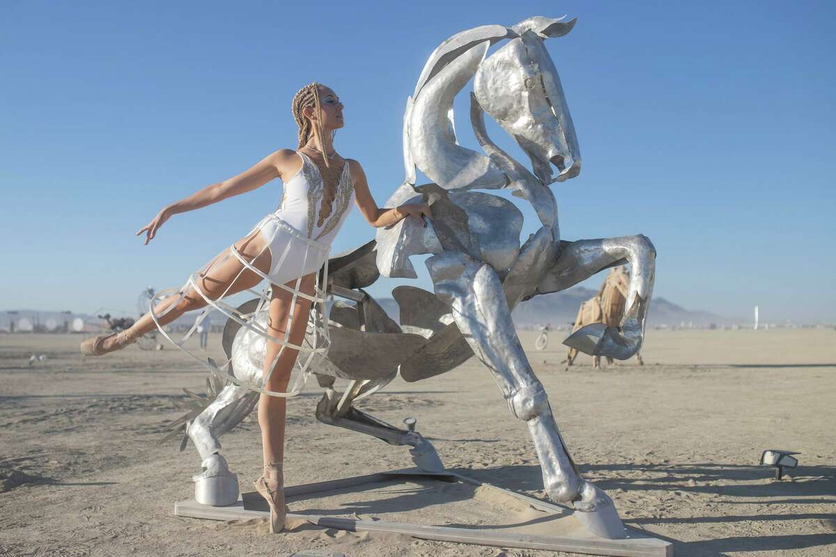 Marlo Bassett of the Metamorphosis Ballet at Wild Horses of the American West by Artist Collective of Reno, Nevada at Burning Man 2022 in the Black Rock Desert in Gerlach, Nevada.