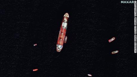 Satellite images show the damaged and partially submerged OS 35 cargo ship off the coast of Gibraltar. 
