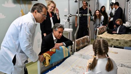 US Secretary of State Anthony Blinken talks with Marina, 6, from Kherson region, during his visit to the Children's Hospital in Kyiv.