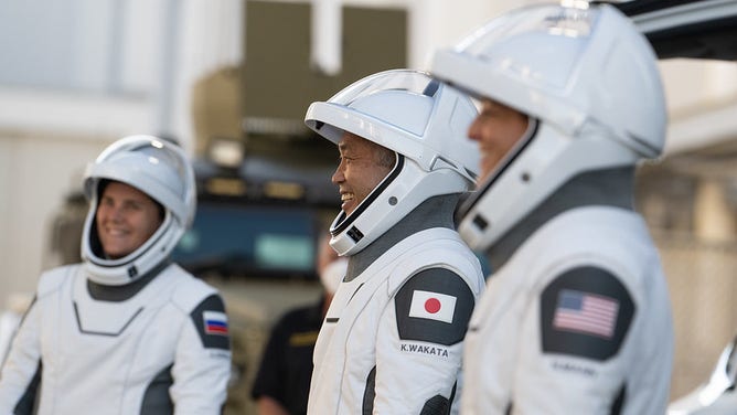 NASA astronauts Josh Cassada, left, and Nicole Mann, second from left, JAXA astronauts, JAXA astronauts, second from right, and Roscosmos astronaut Anna Kekina, right, wearing suits SpaceX, seen as they prepare to leave the ship.  Neil A's operations.