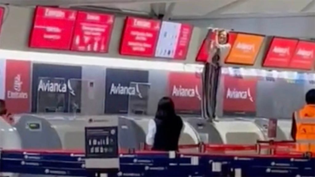 Tantrum by a traveler: A woman is shown in a video attacking an airline check-in agent at Mexico City Airport