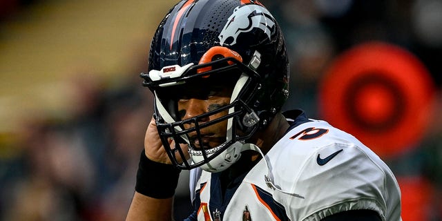 Denver Broncos' Russell Wilson (3) reacts to the Jacksonville Jaguars' interception during the first quarter at Wembley Stadium, London, Sunday, October 30, 2022.