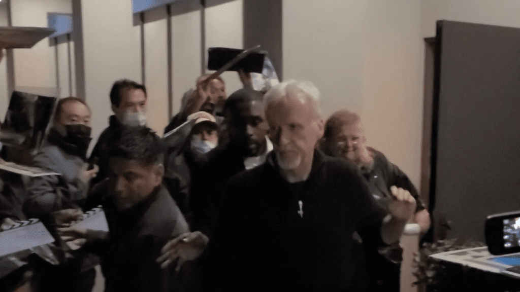 James Cameron flips through autograph seekers after the Avatar movie premieres
