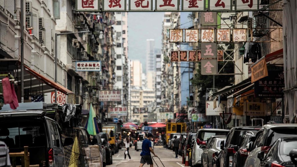 Hong Kong shares rose about 3% after reports said the city was considering easing a Covid law